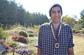 Photo: Anthropology graduate Nick with medal