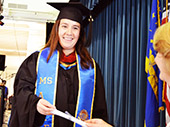 Photo: Graduate receiving their diploma