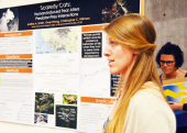 Justine Smith, Environmental Studies with her poster presentation, "Scaredy Cats: Human-Induced Fear Alters Predator-Prey Interactions."