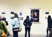 Faculty, staff, students, community members, and friends all gather to view student produced media about low wage worker conditions in Santa Cruz county. Sociology student Edward Ramirez took many of the photos on display.