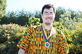 Photo: Anthropology graduate Christopher with medallion