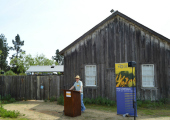 Daniel Press makes his opening remarks at the barn raising