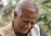 Yunus signing a book