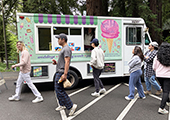 students getting ice cream from truck