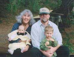 Cindy and Rick, both UCSC alumni, with two of their five grandchildren.